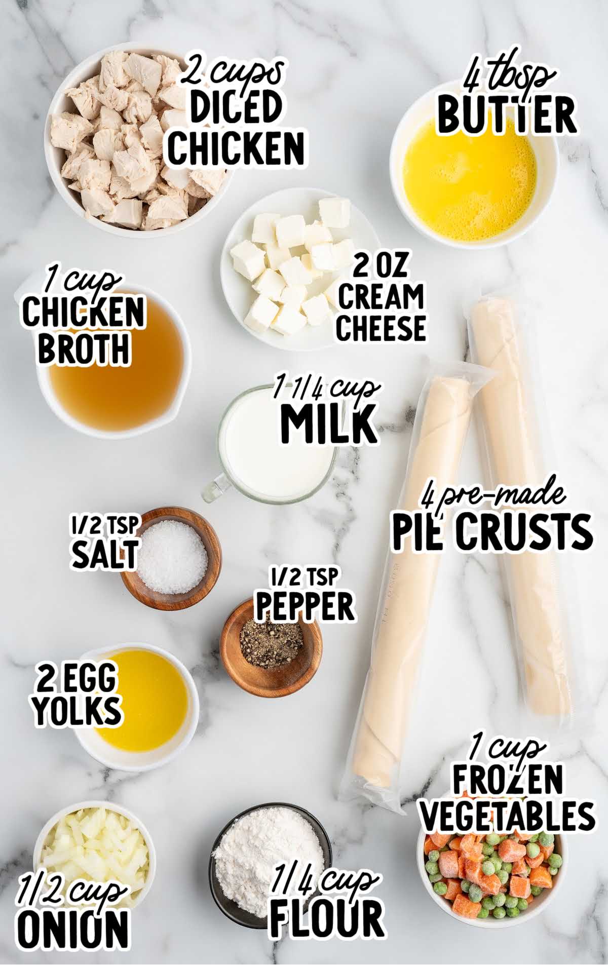 Ingredients for chicken hand pies including diced chicken, frozen vegetables, pie crusts, cream cheese, milk, broth, flour, onion, butter, egg yolks, salt, and pepper