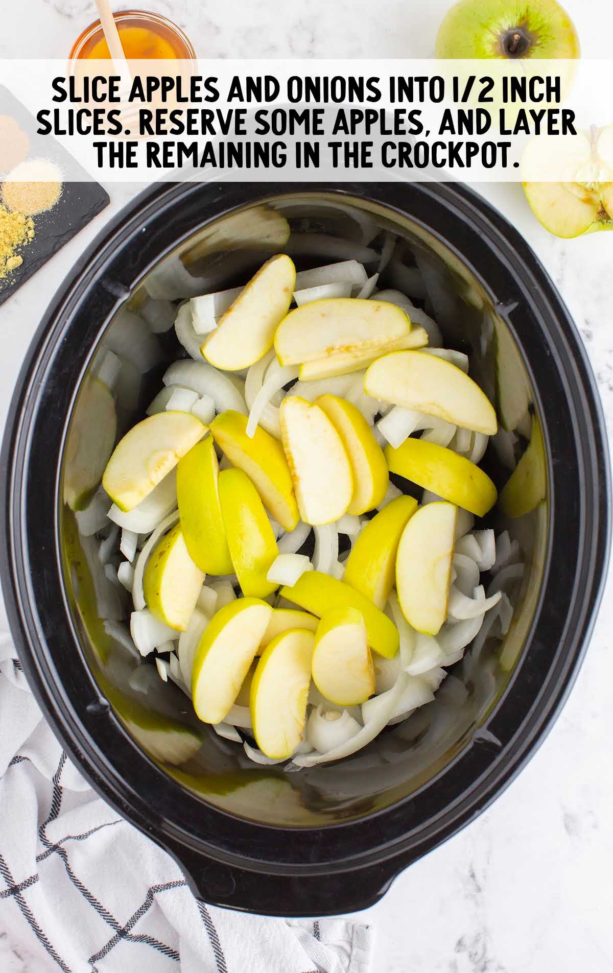sliced apples and onions in a crockpot