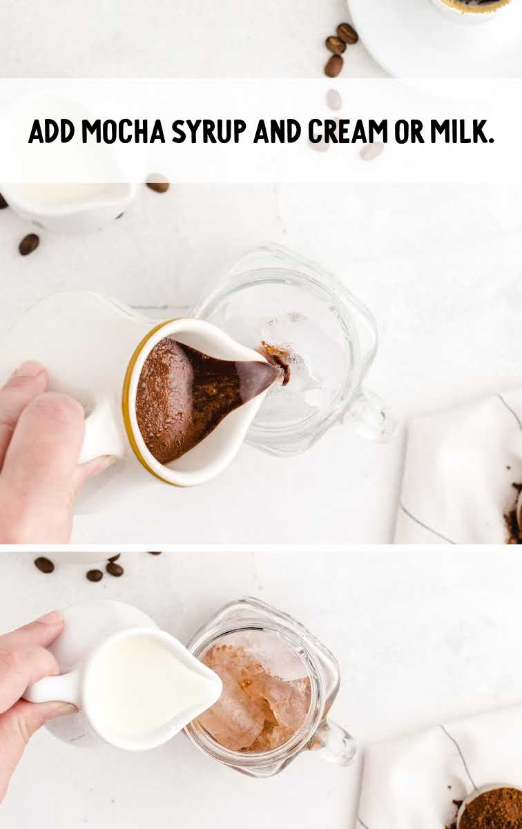 mocha syrup and cream/milk being added to glass of ice