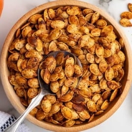 Bowl of oven roasted pumpkin seeds served as a crunchy snack