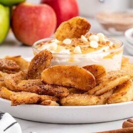 close up shot of a plate of Apple Fries with a bowl of dipping sauce