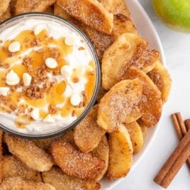 close up shot of a plate of Apple Fries with a bowl of dipping sauce