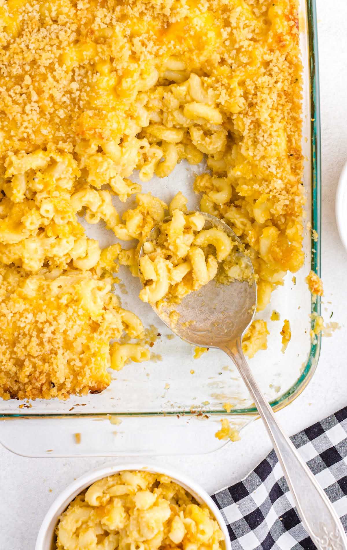 close up overhead shot of Baked Mac and Cheese in a baking dish and a serving in a bowl