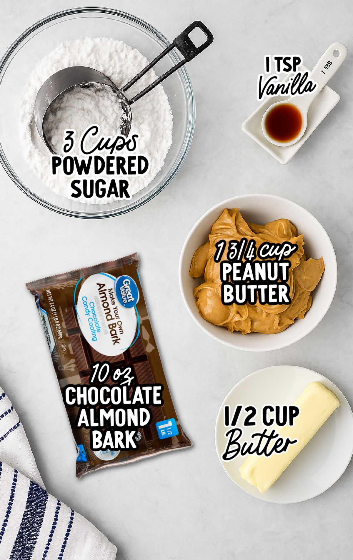 Flat lay of labeled ingredients for buckeye candies, including peanut butter, powdered sugar, chocolate almond bark, vanilla, and butter.