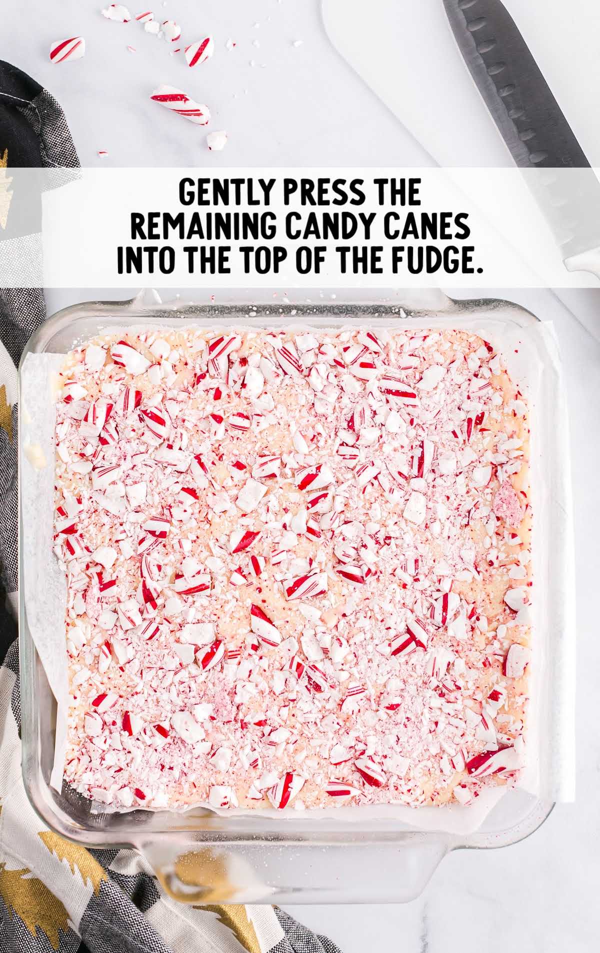 crushed candy canes pressed on top the fudge
