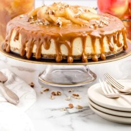 shot of Caramel Apple Cheesecake on a cake stand