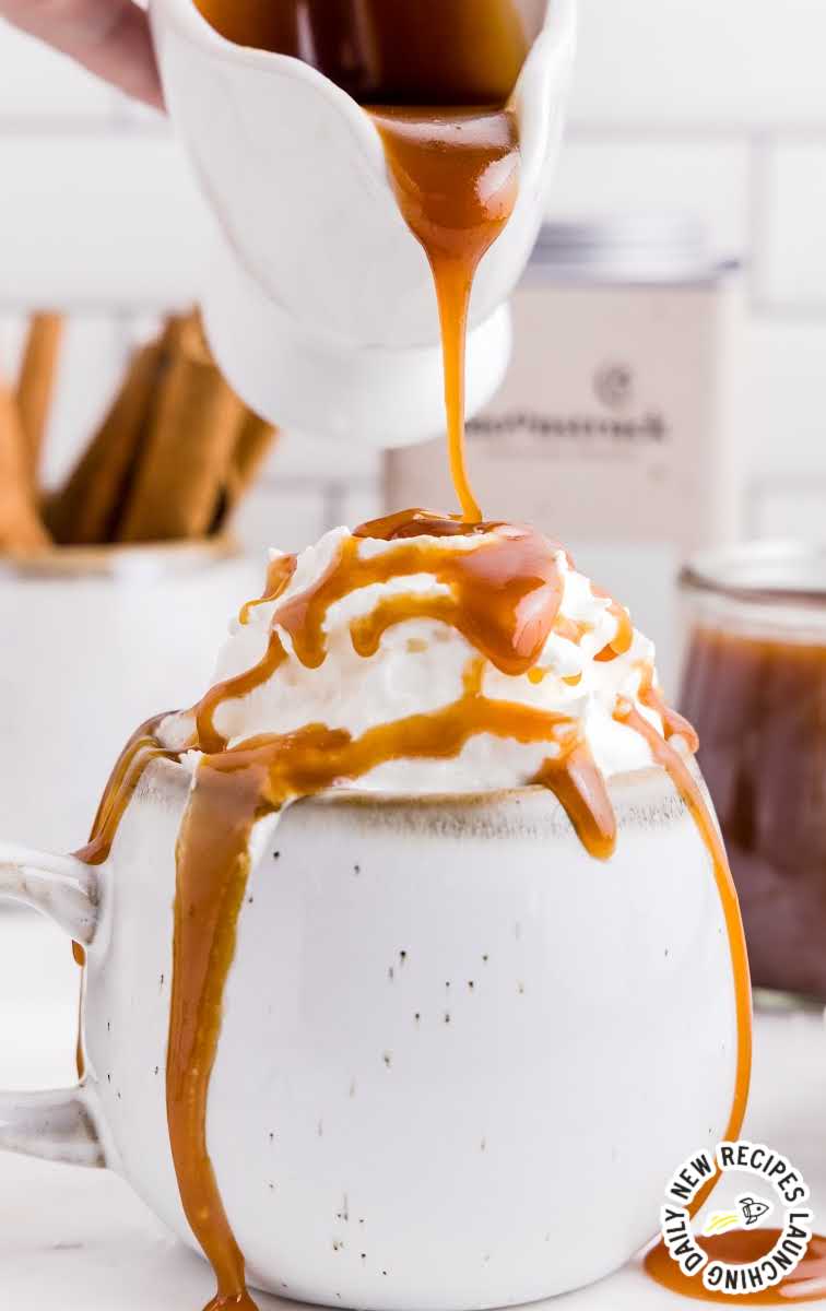 close up shot of Caramel Sauce being poured over a bowl of vanilla ice cream