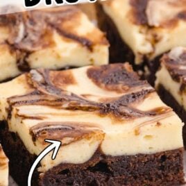 close up shot of Cheesecake Brownies on a wooden board