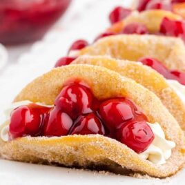 close up shot of Cherry Cheesecake Tacos on a serving tray