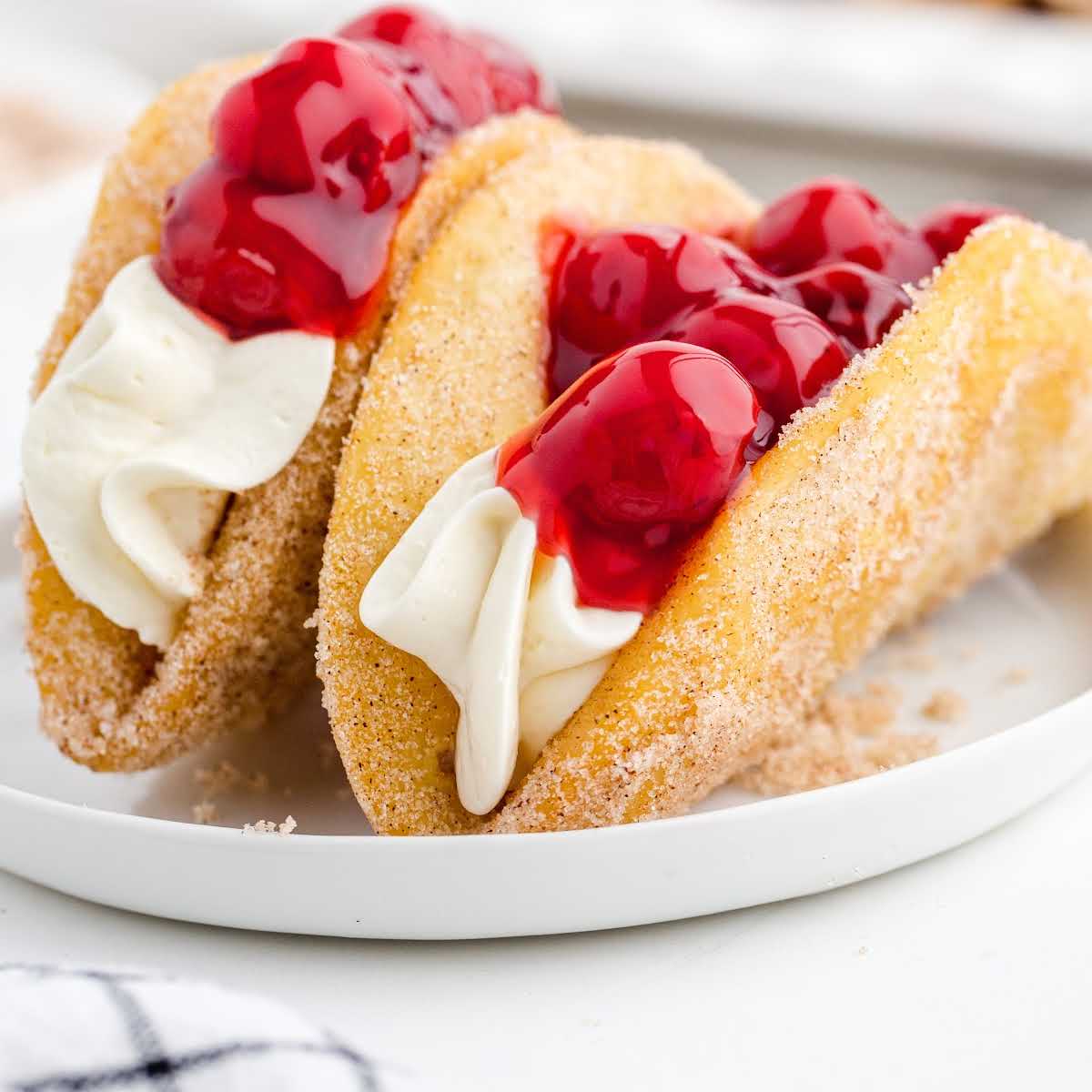 close up shot of Cherry Cheesecake Tacos on a plate
