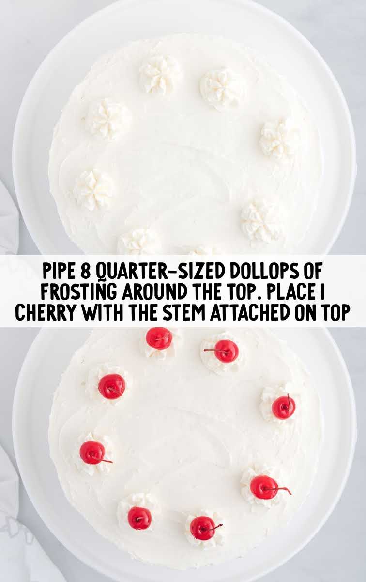 dollops of frosting placed on top of cake and topped with cherries