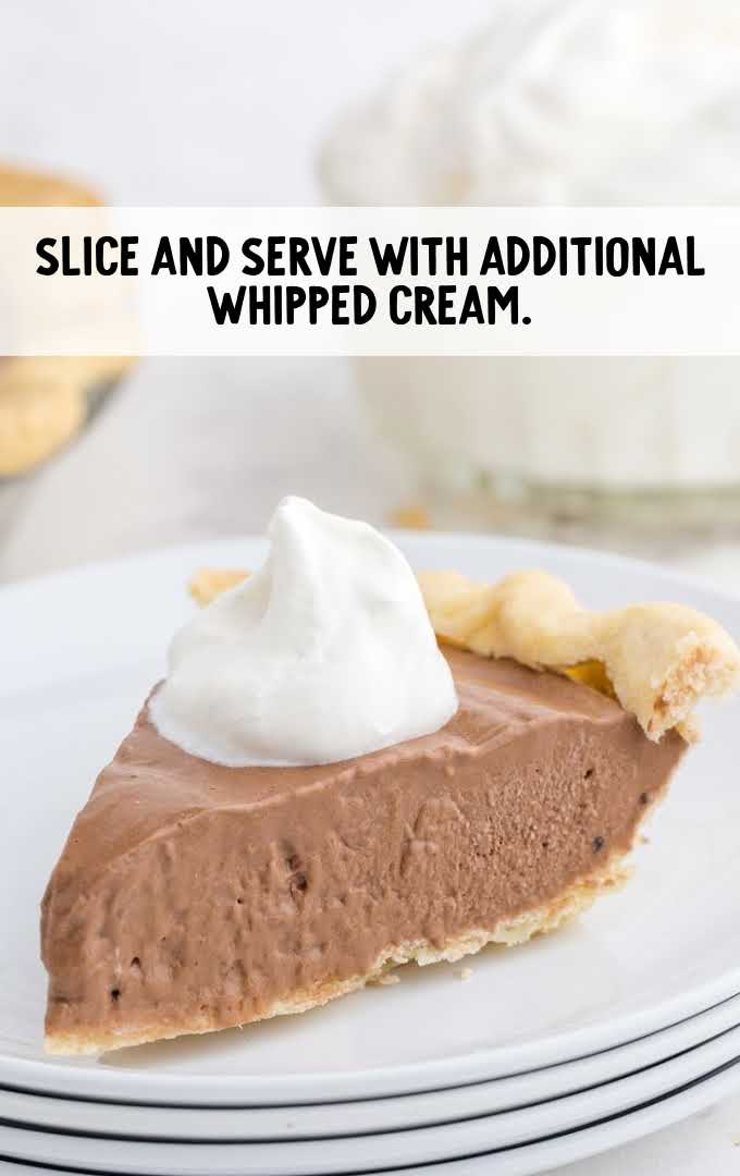 Chocolate Pie process shot whipped cream topped on a slice of pie