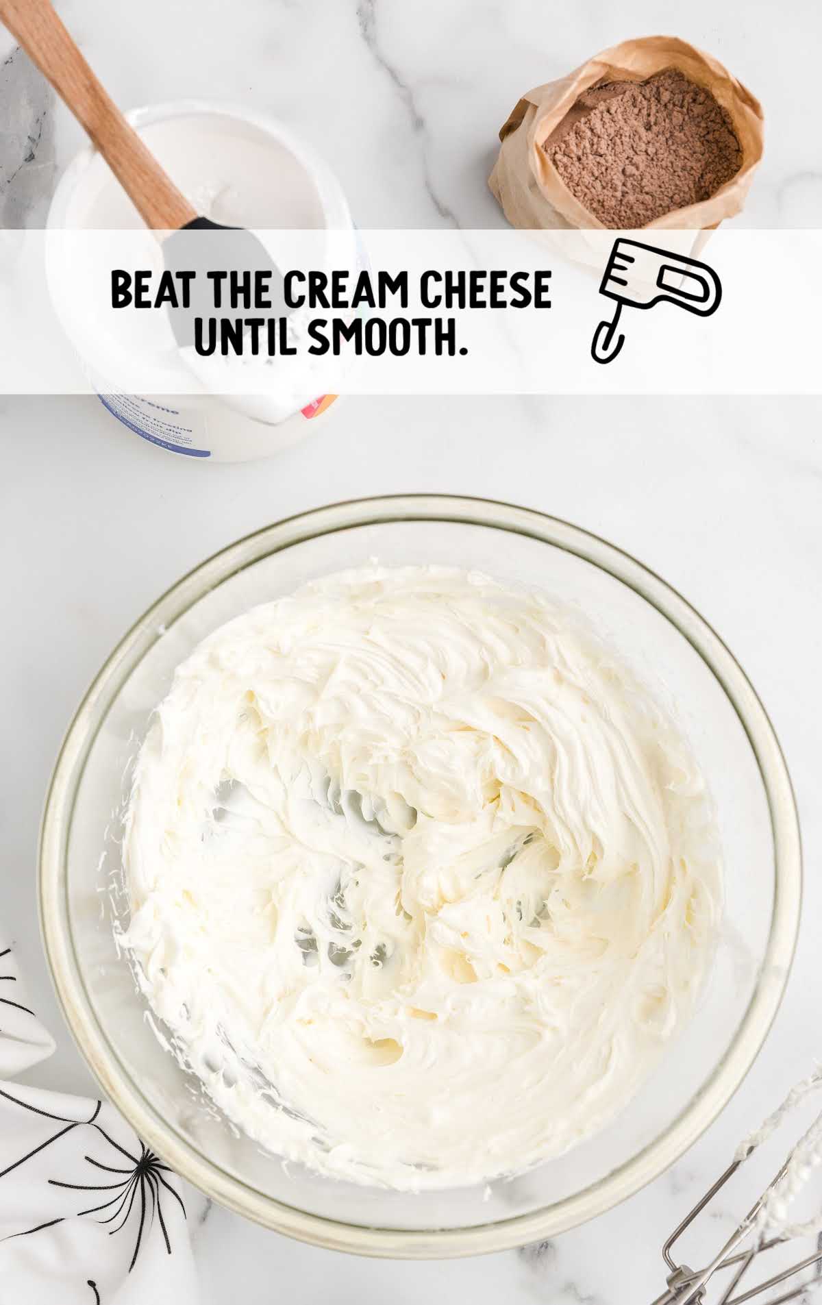 Cream cheese beaten until smooth in a glass bowl with other ingredients nearby and a text instruction overlay.
