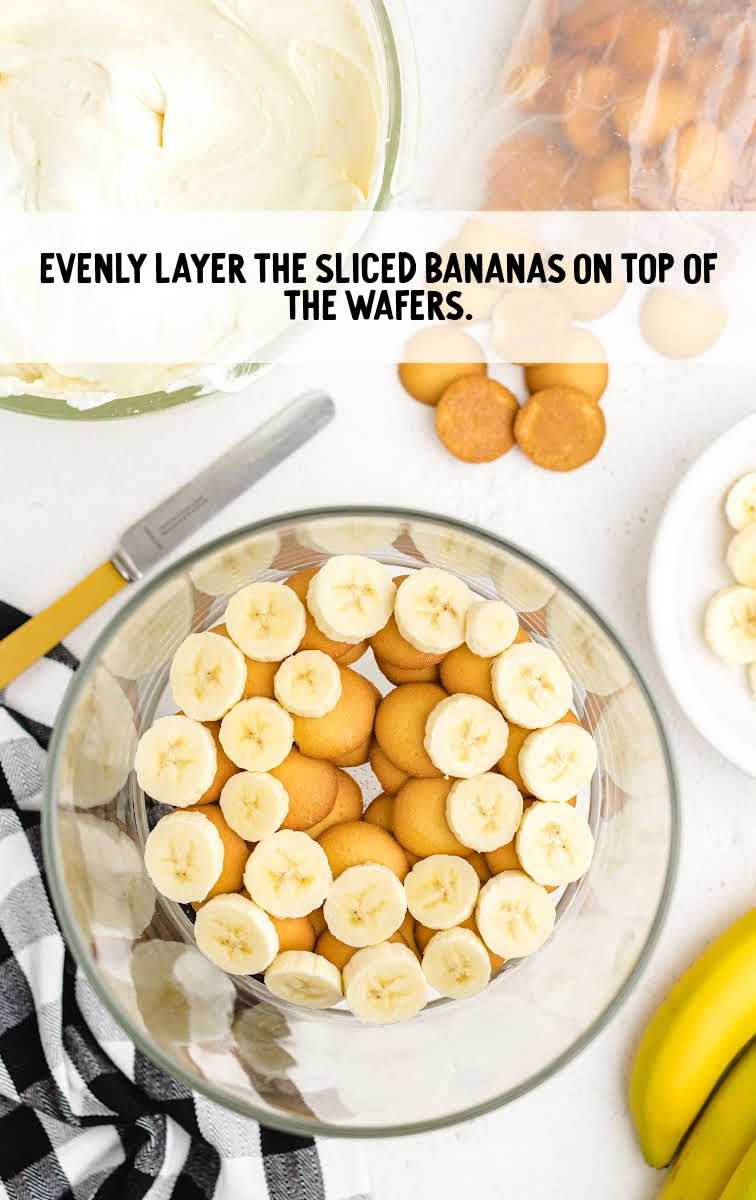 copycat magnolia banana pudding process shot of banana slices layered on top of vanilla wafers