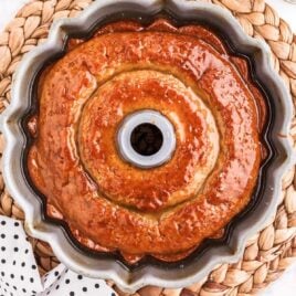 close up overhead shot of Crack Cake topped with a glaze in a bundt pan