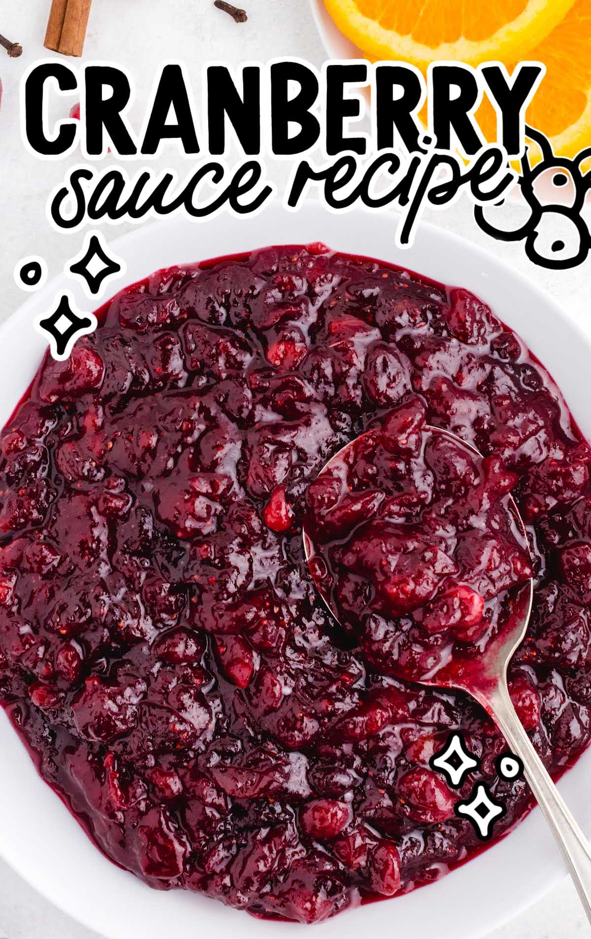 close up shot of a bowl of Cranberry Sauce with a spoon