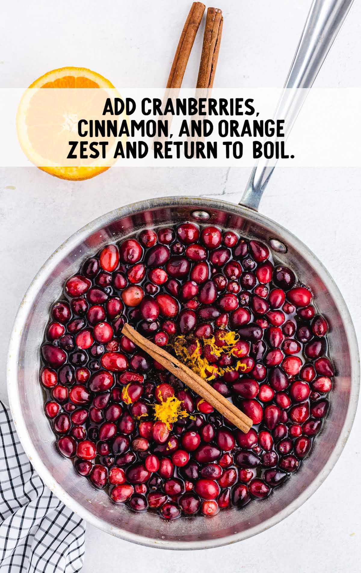 add cranberries, cinnamon, and orange zest to the sugar mixture in a pot