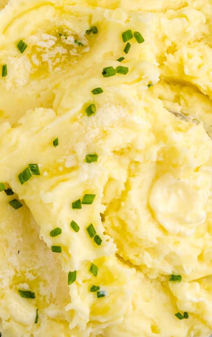 close up overhead shot of Creamy Mashed Potatoes garnished with chives