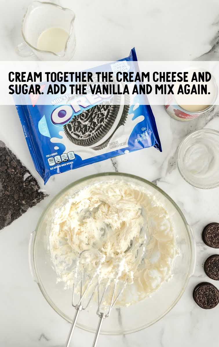 Easy Frozen Oreo Dessert process shot of ingredients being blended together in a bowl