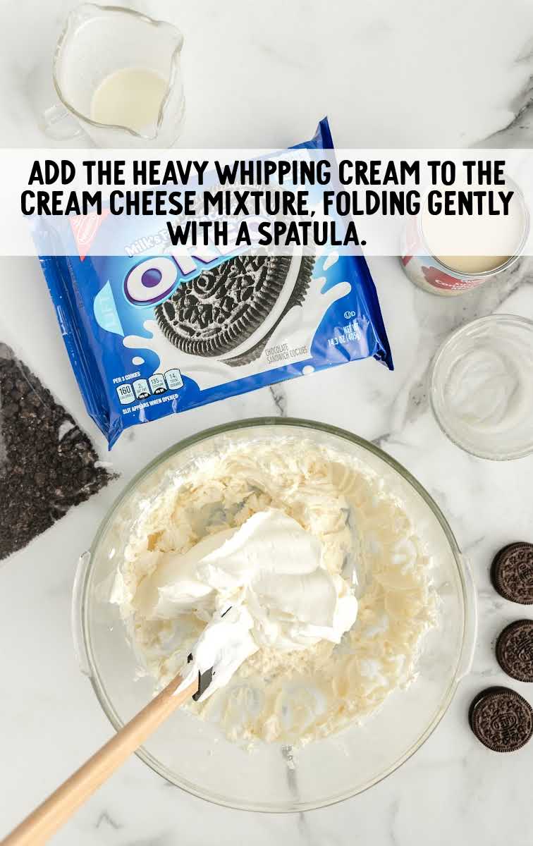 Heavy whipping cream added to the cream cheese mixture and folded together in a bowl