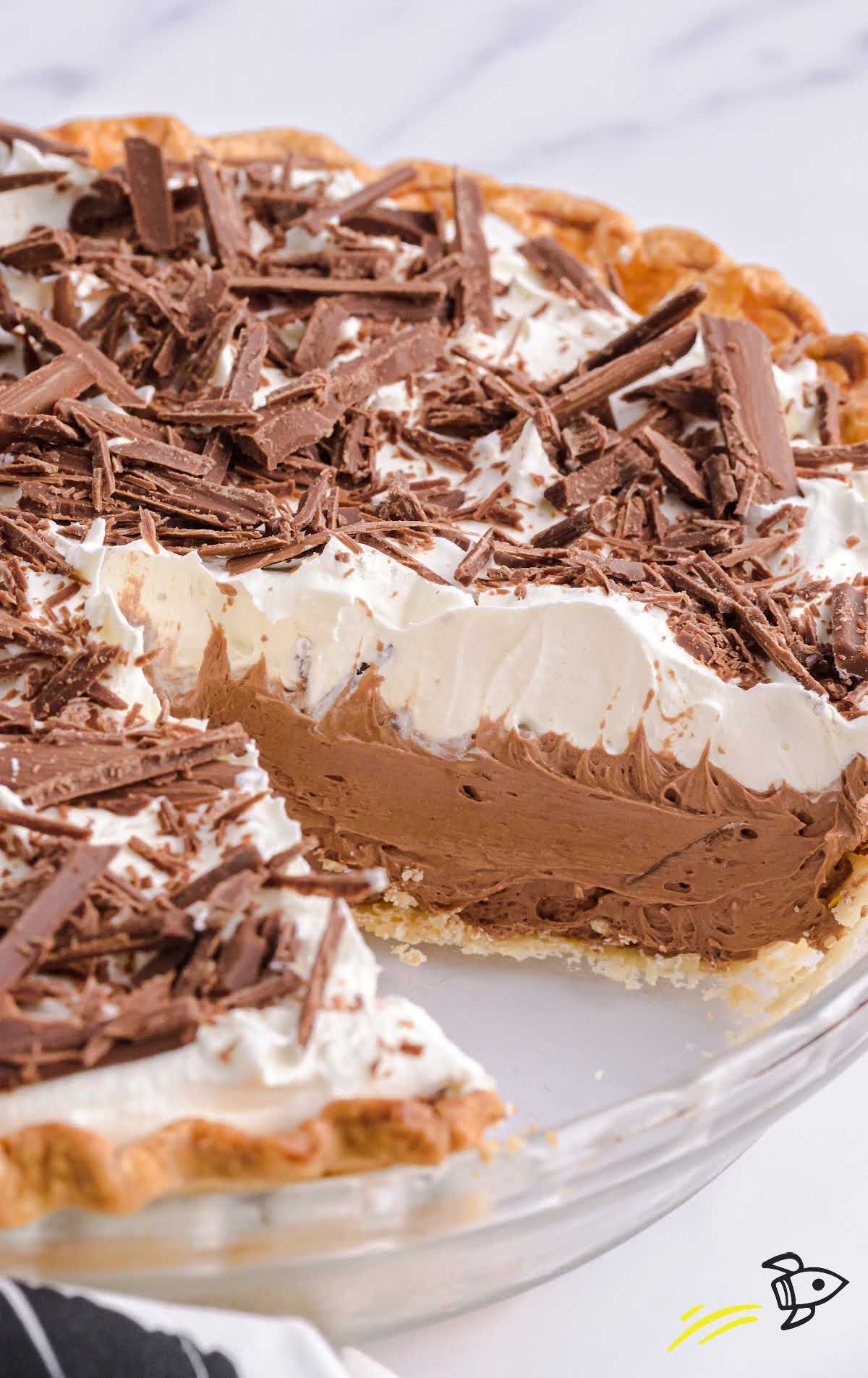 a french silk pie garnished with chopped chocolate on a plate