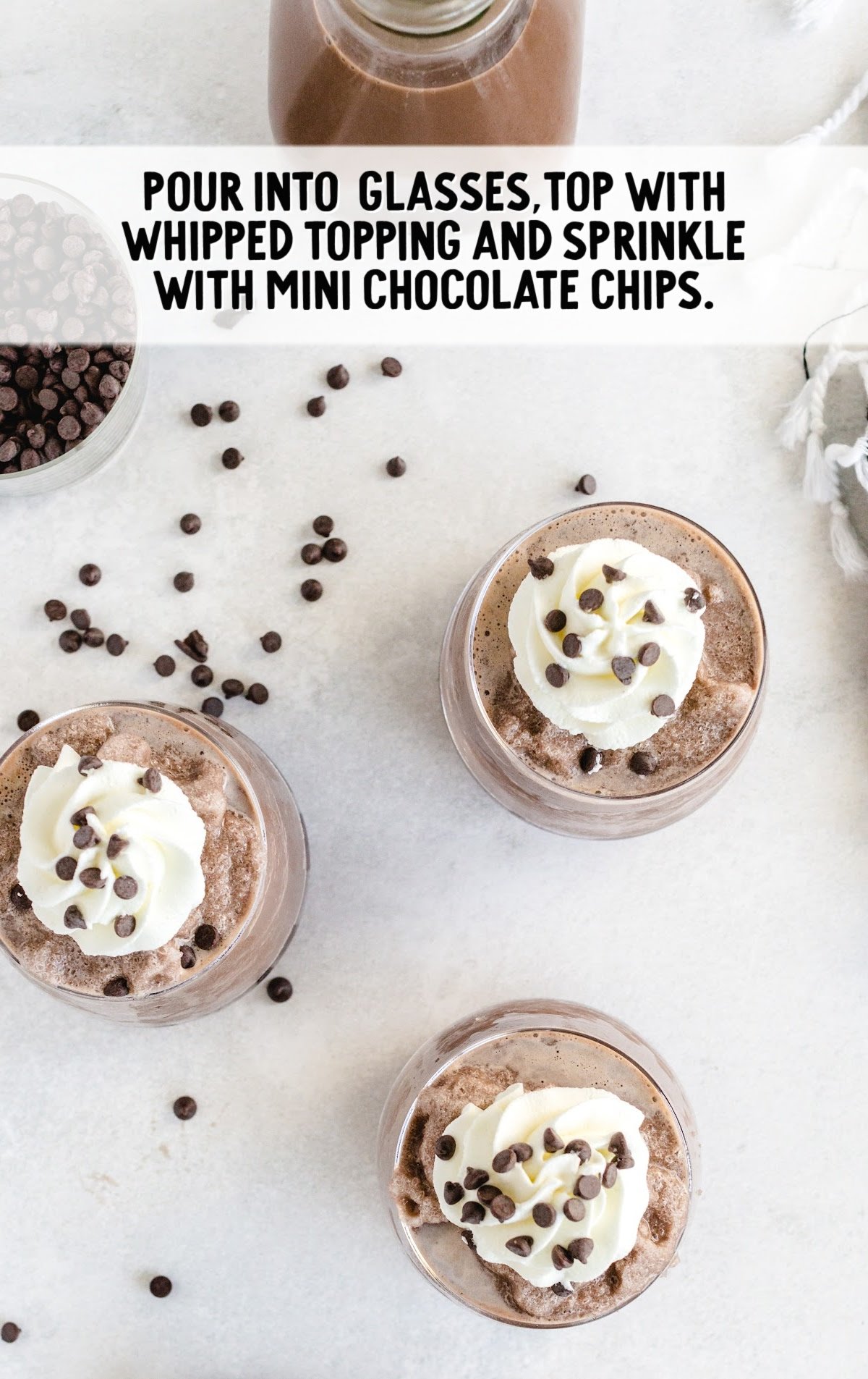 Frozen Hot Chocolate topped with whipped cream and sprinkled with mini chocolate chips