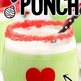 close up shot of a glass of Grinch Punch with straws