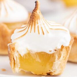 close up shot of Mini Lemon Meringue Pies on a plate