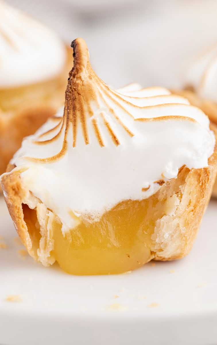 close up shot of Mini Lemon Meringue Pies on a plate