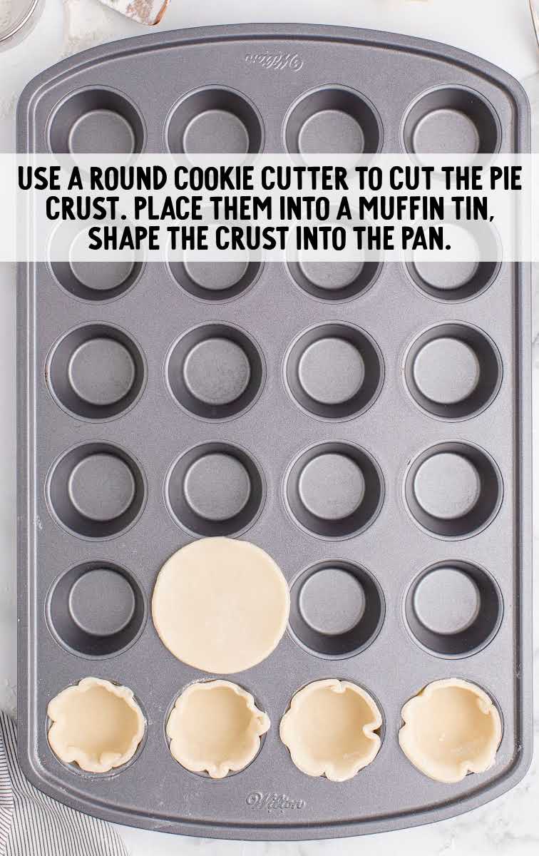 pie crust placed into a muffin tin