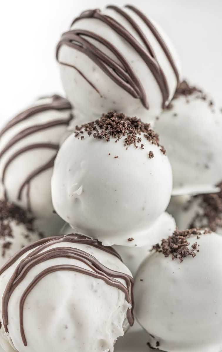 close up shot of Oreo Truffles garnished with oreo crumbles or melted chocolate