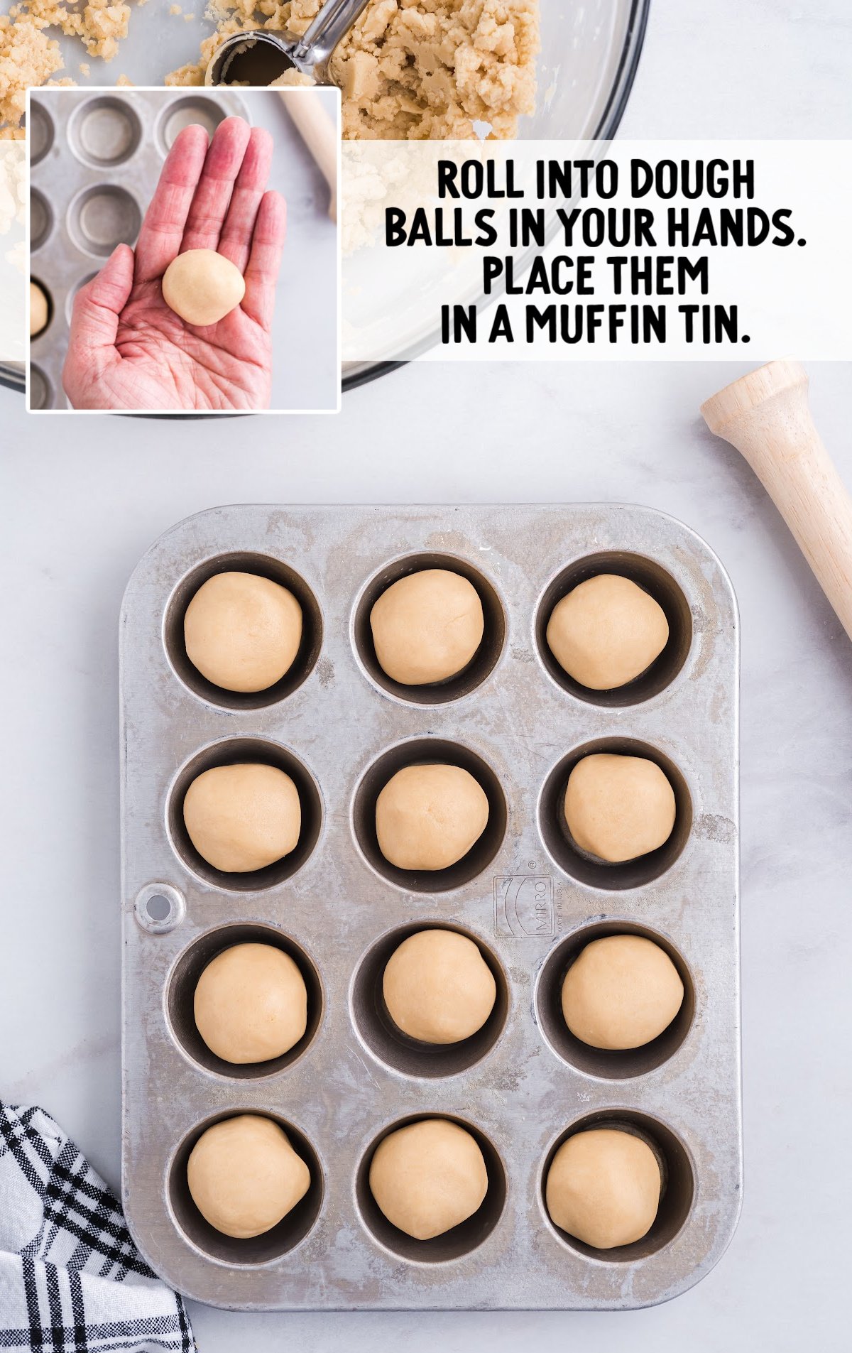 The dough balls are rolled and placed in a muffin tin.