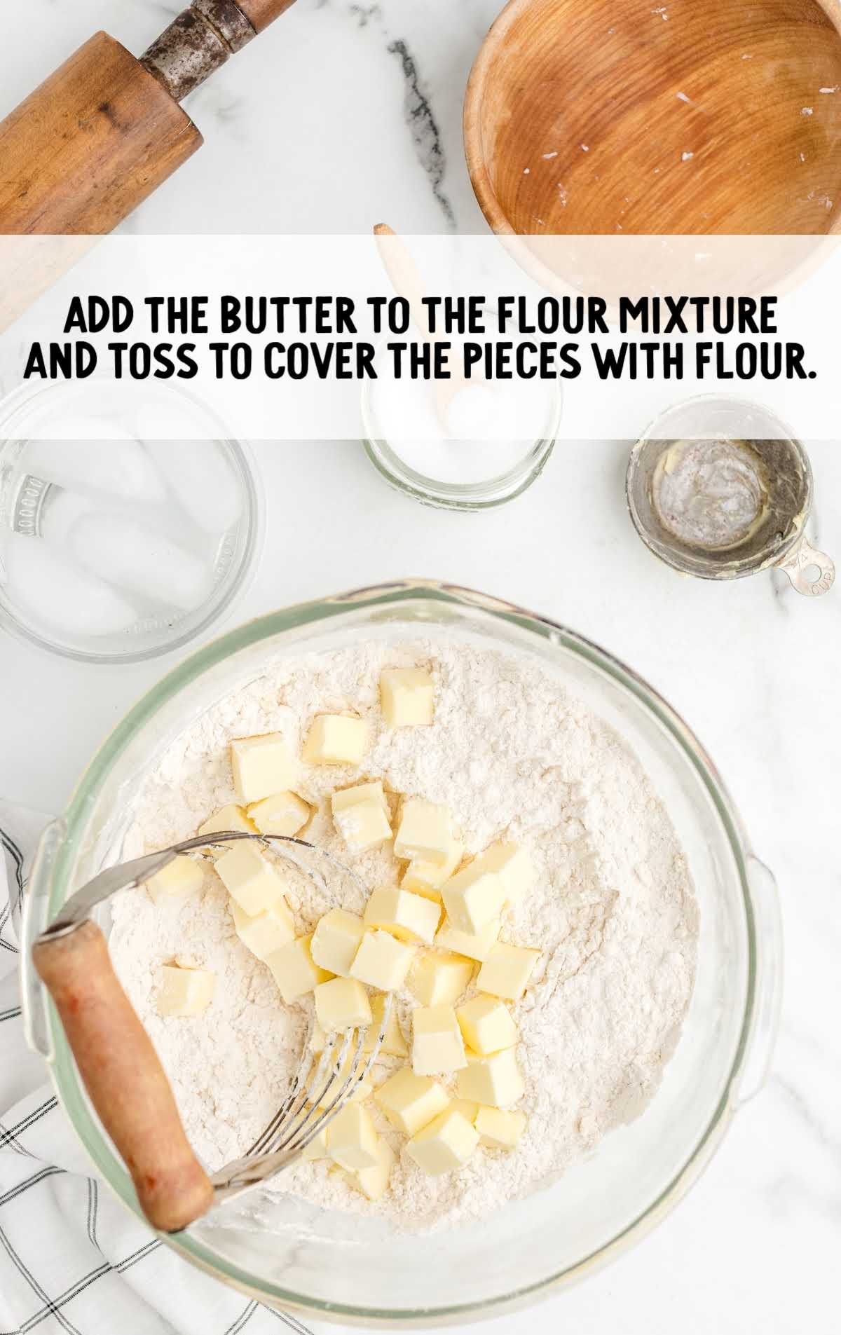 butter added to the flour mixture in a bowl