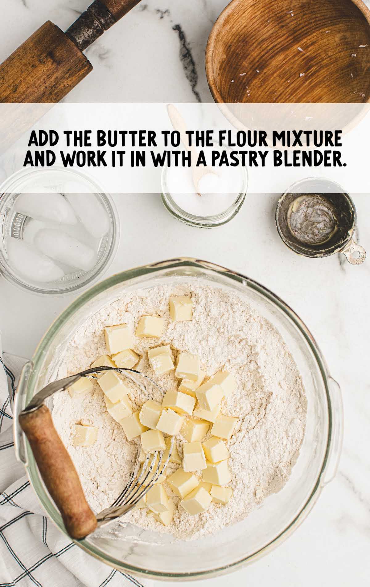 butter added to the flour mixture in a bowl