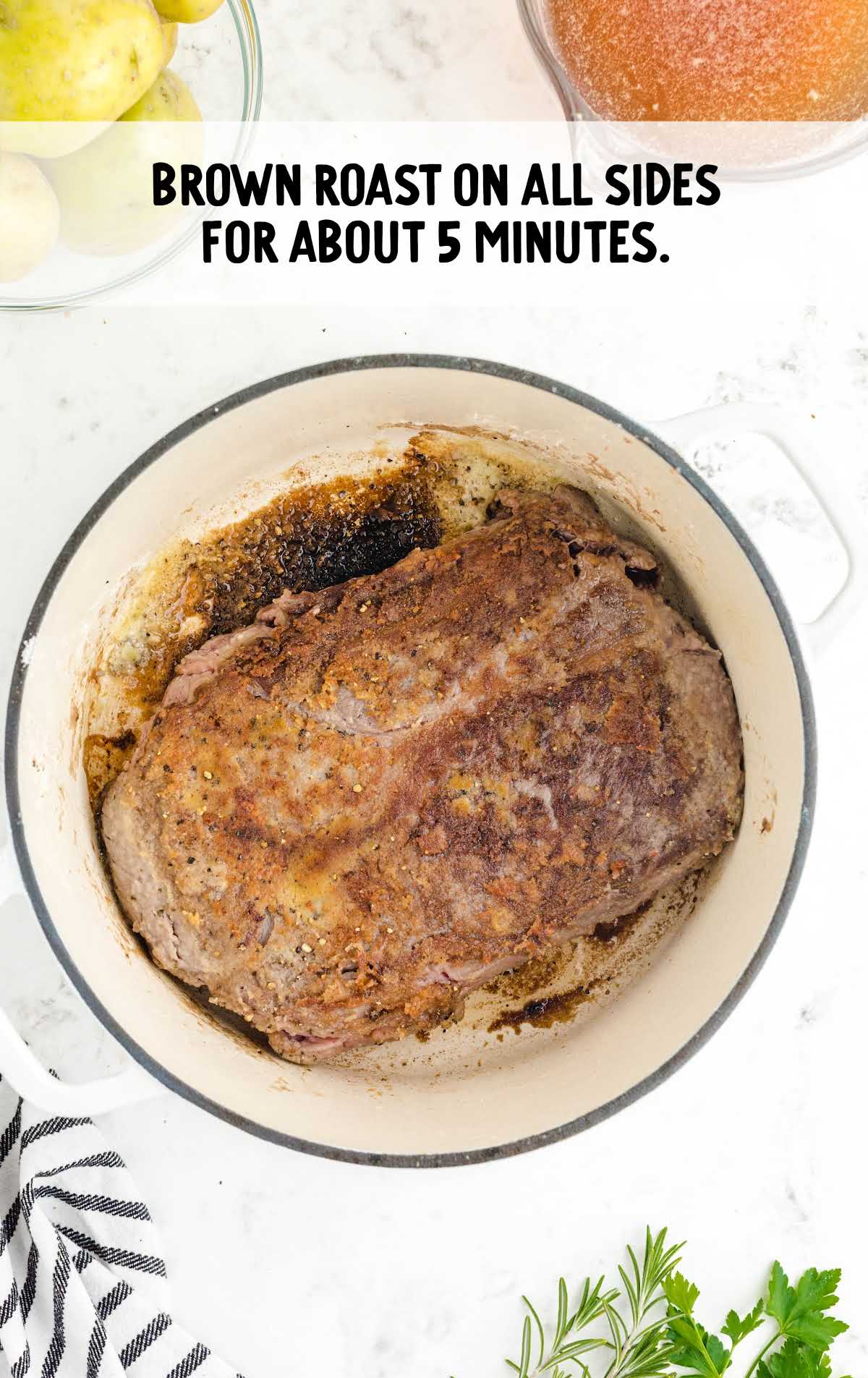 roast being browned in a pot