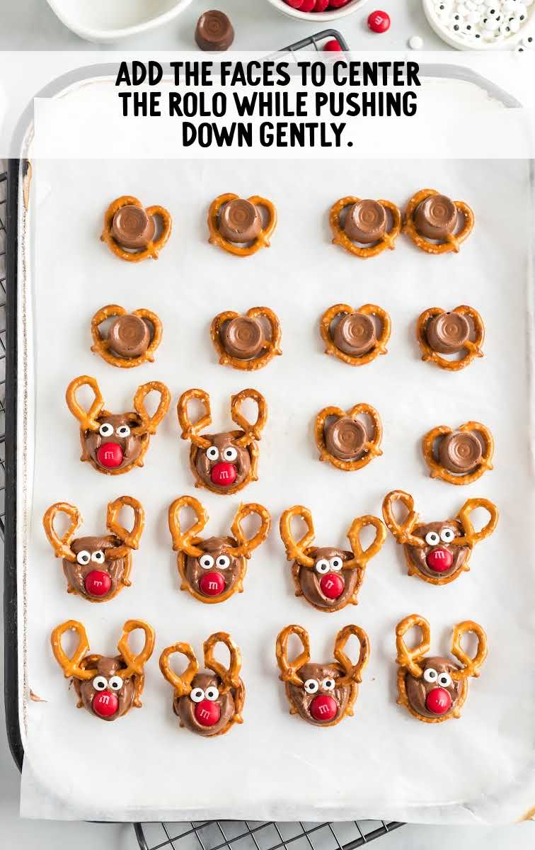 Reindeer Pretzels process shot of candy faces assembled on top of pretzels