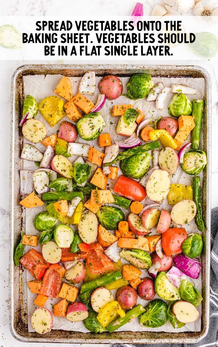 Roasted Vegetables process shot of vegetables spread onto a sheet pan