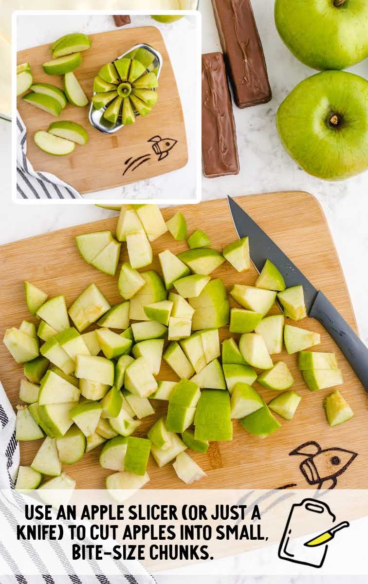 Snickers Salad process shot of apples being sliced on a wooden board
