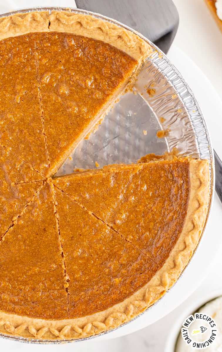 close up overhead shot of a Sweet potato pie with a slice missing