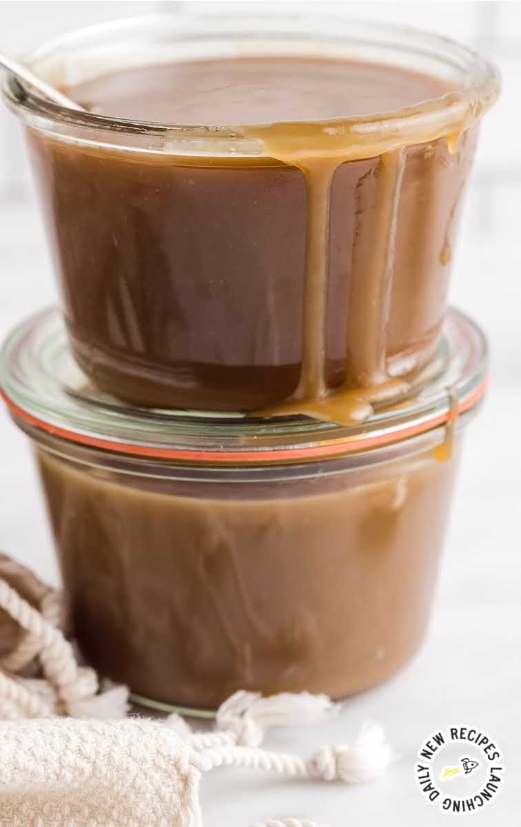 close up shot of jars of toffee sauce stacked on top of each other