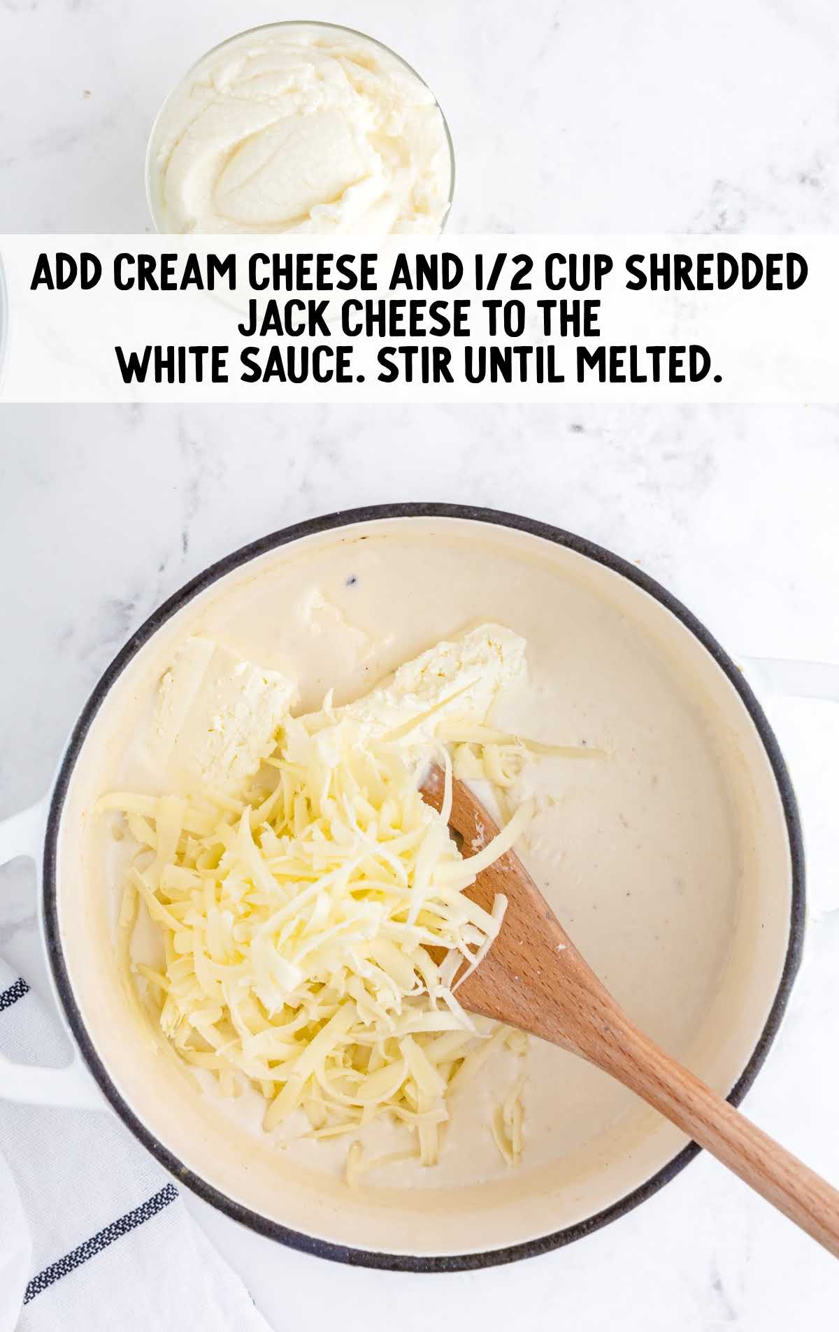 cream cheese and shredded jack cheese added to the white sauce