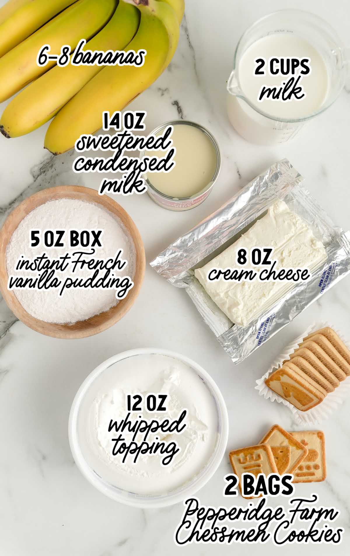 Flat lay of ingredients for chessmen banana pudding including bananas, pudding mix, condensed milk, whipped topping, milk, cream cheese, and cookies.