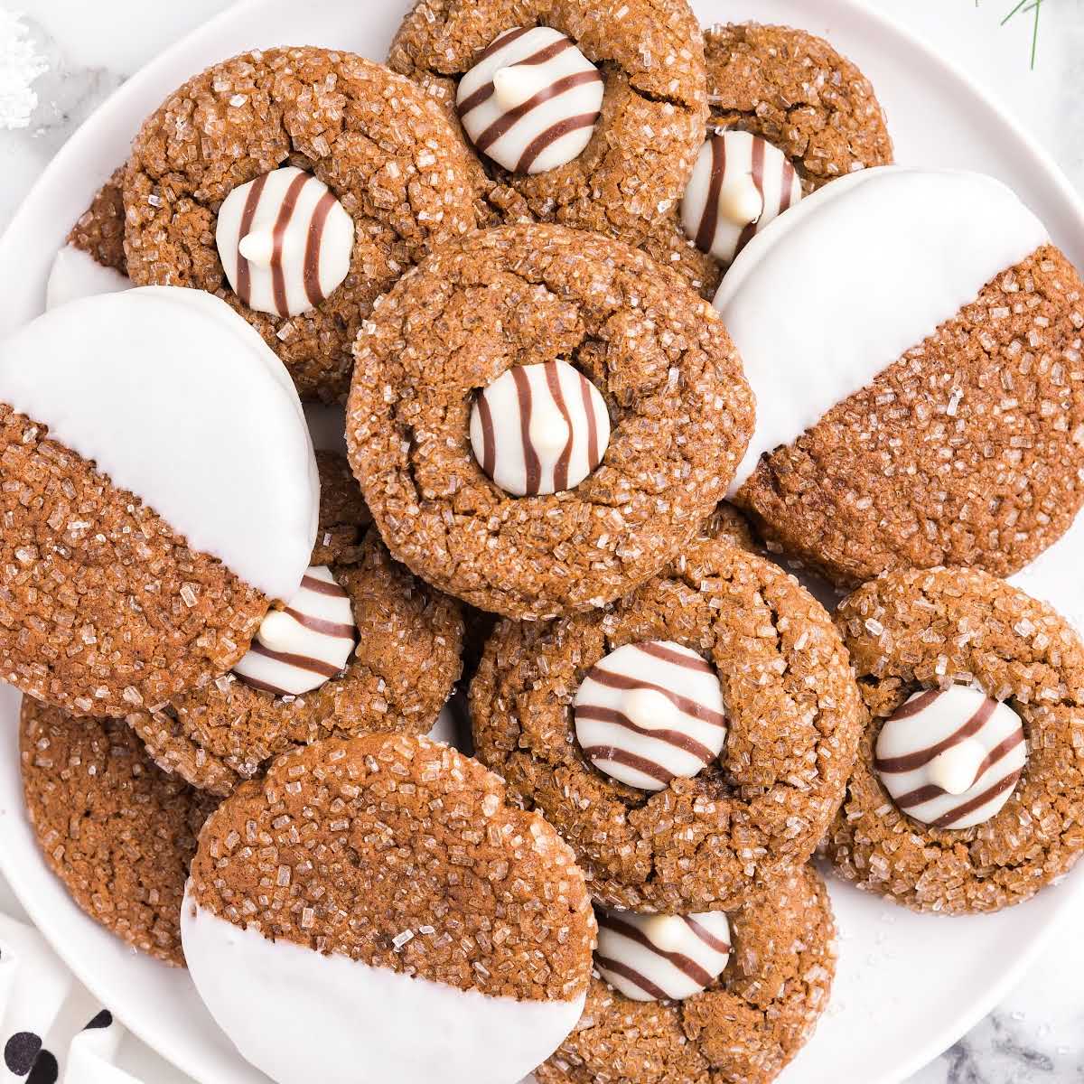 close up shot of gingerbread kiss cookies pile on a plate
