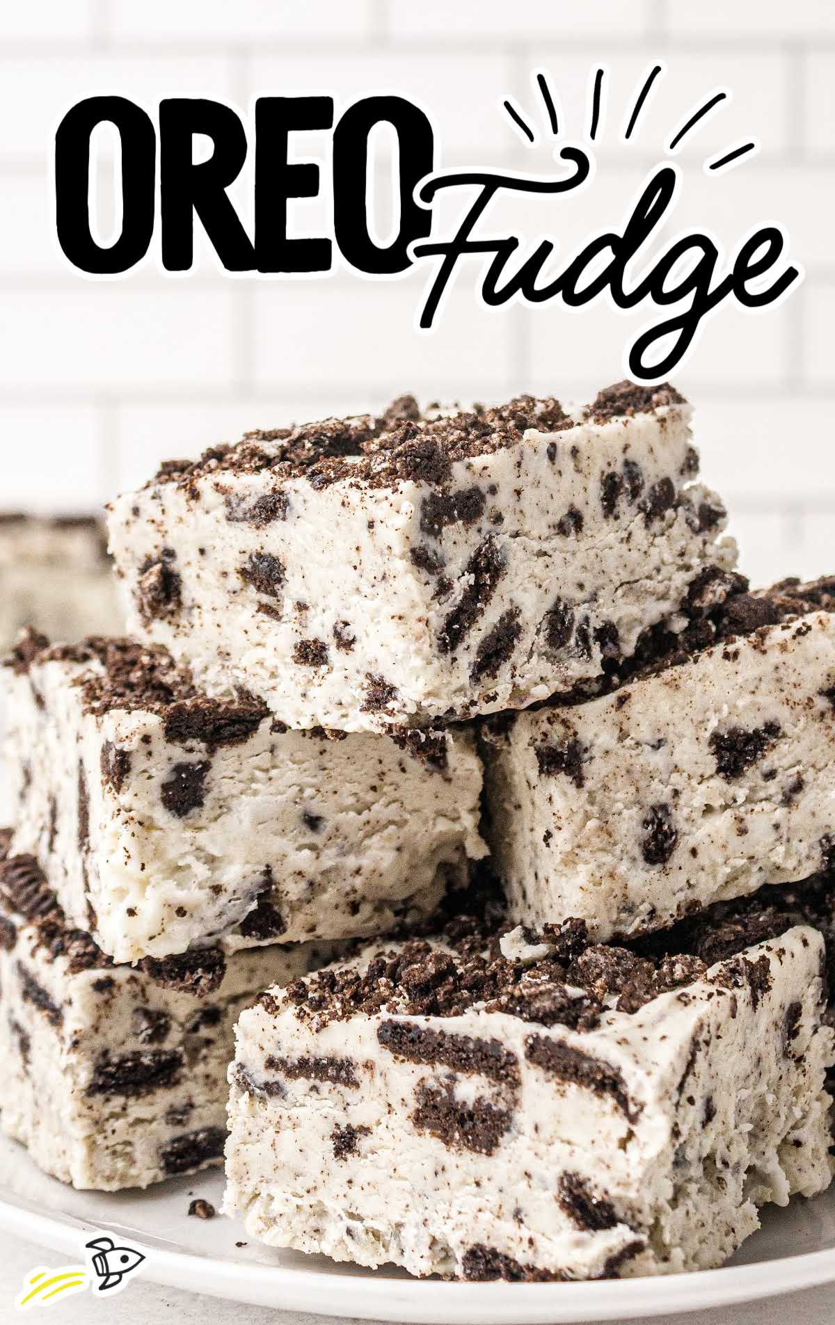 close up shot of oreo fudge stacked on top of each other on a plate