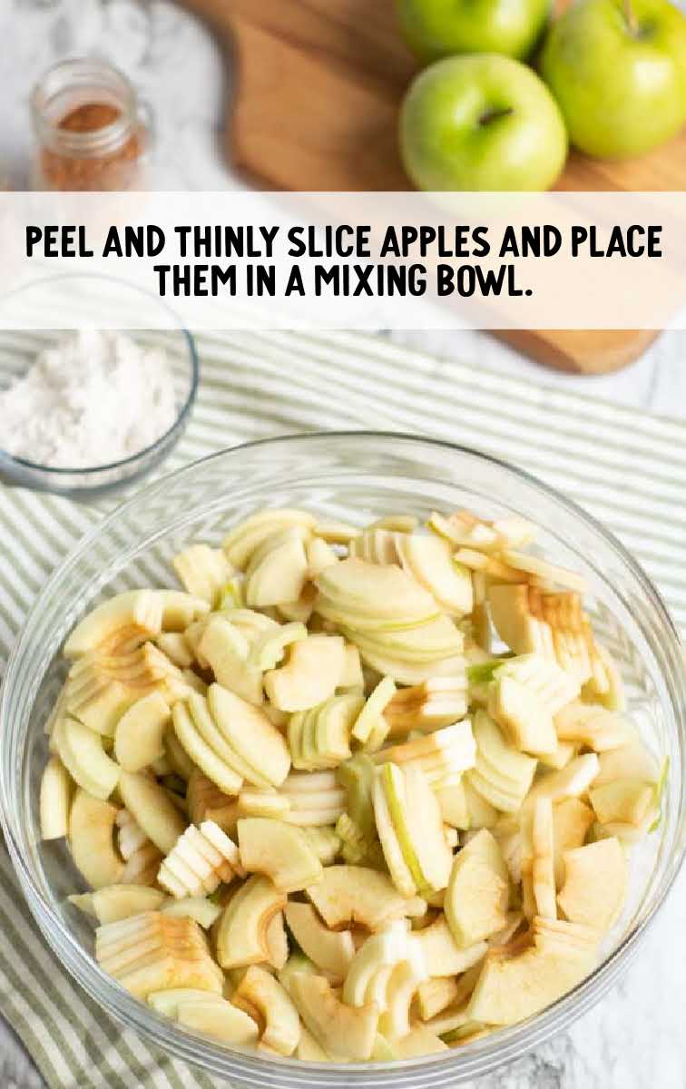 Apple Pie Recipe process shot of sliced pieces of apples in a bowl