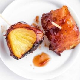 close up overhead shot of a plate of Bacon-Wrapped Pineapple
