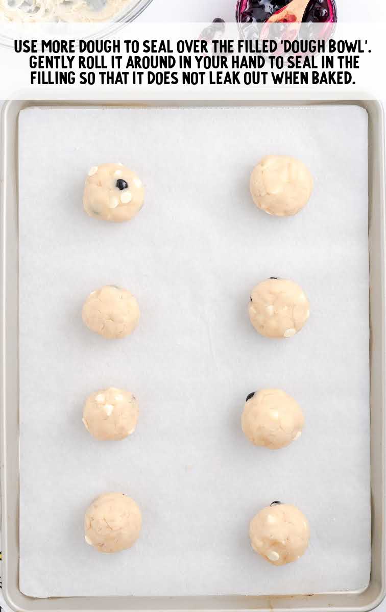 Blueberry Cookies process shot of balls of cookie dough on a baking sheet