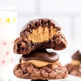 close up shot of Buckeye Brownie Cookies stacked on top of each other