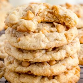 close up shot of Butterscotch Toffee Cookies stacked on top of each other on a cooling rack