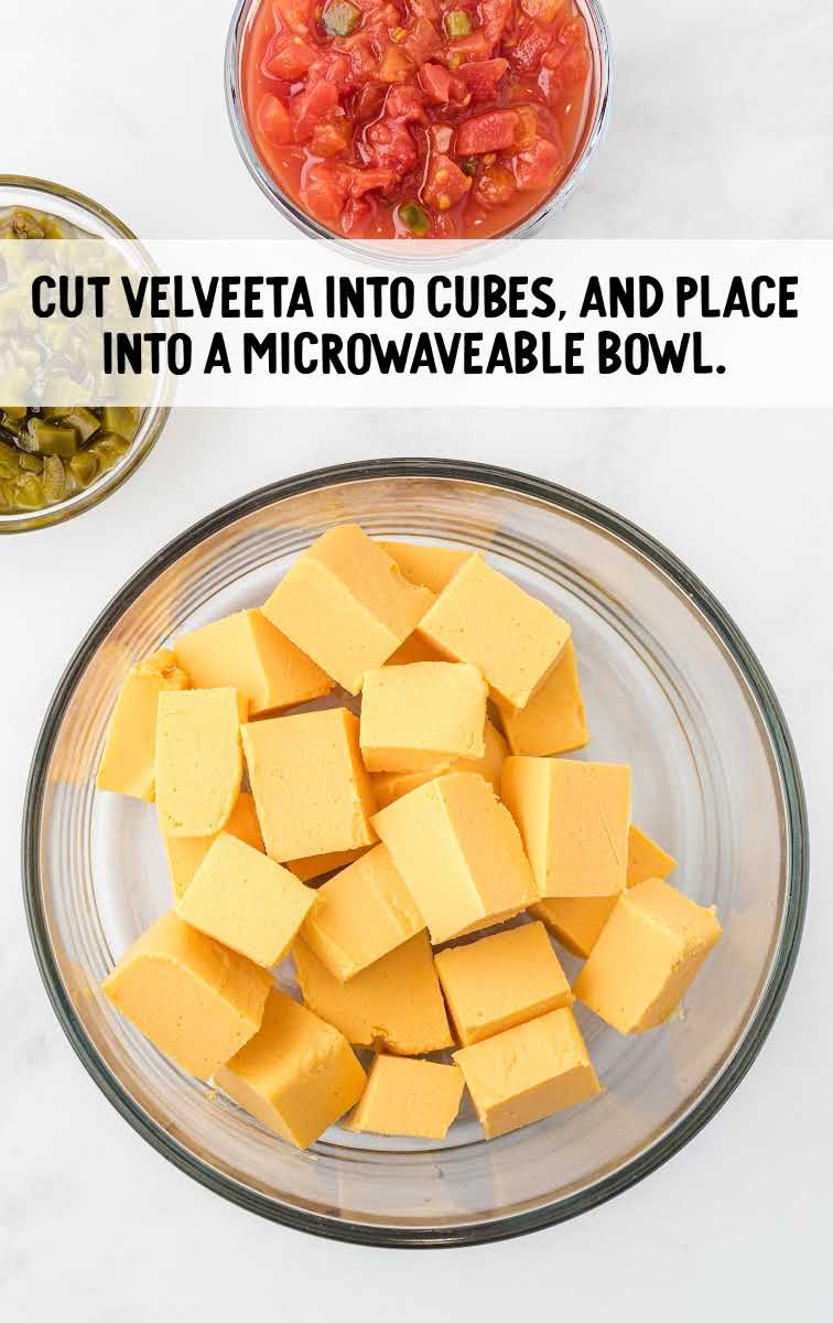 Cheese Dip process shot of velveeta cheese cut into cubes and placed into a bowl